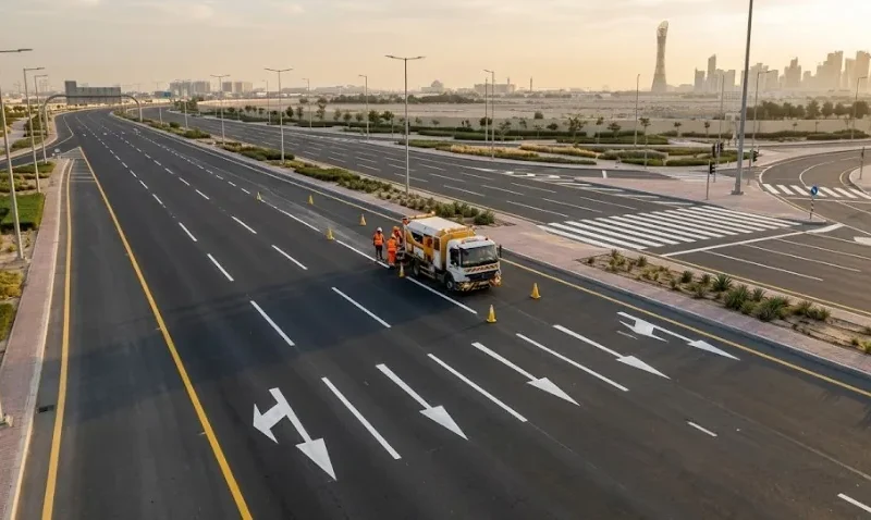 Freshly applied lane lines and directional arrows on a new road in Qatar by UniGulf Traffic